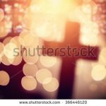 stock-photo-abstract-defocussed-cross-silhouette-in-church-interior-against-stained-glass-window-concept-for-366446120