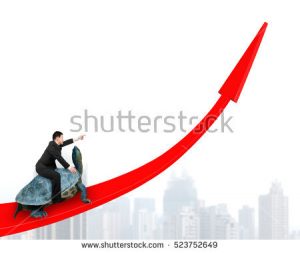 stock-photo-businessman-with-pointing-finger-gesture-riding-turtle-on-red-arrow-up-on-city-building-background-523752649